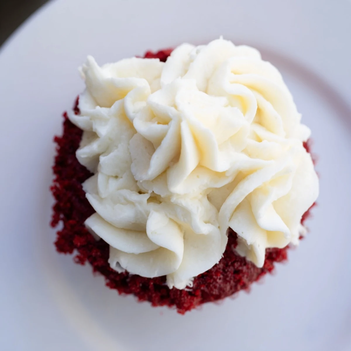 Beautifully frosted red velvet cupcakes, a sweet American treat for a special occasion, ready to eat.