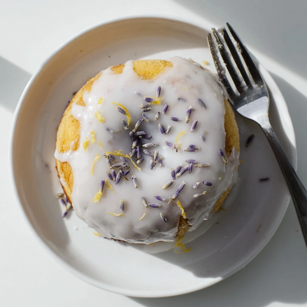 Moist Lemon Lavender Cake topped with syrup glaze, perfect dessert for special occasions or gatherings.