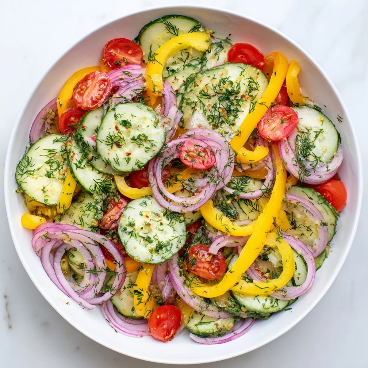 Crisp cucumbers and vibrant bell peppers tossed with zesty lemon dressing for a refreshing side
