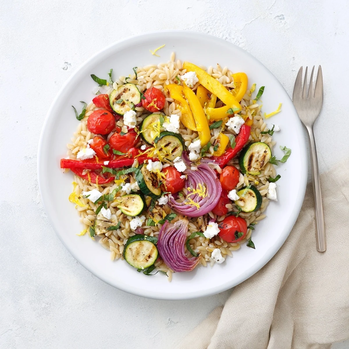 Mediterranean roasted vegetable orzo pasta featuring tender roasted veggies tossed with lemon and bright basil