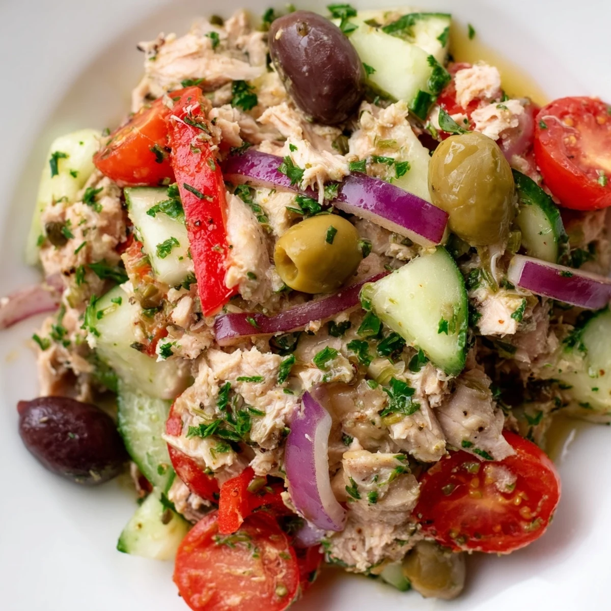 Crisp cucumber and roasted red peppers tossed through flaky Mediterranean tuna salad with lemon dressing