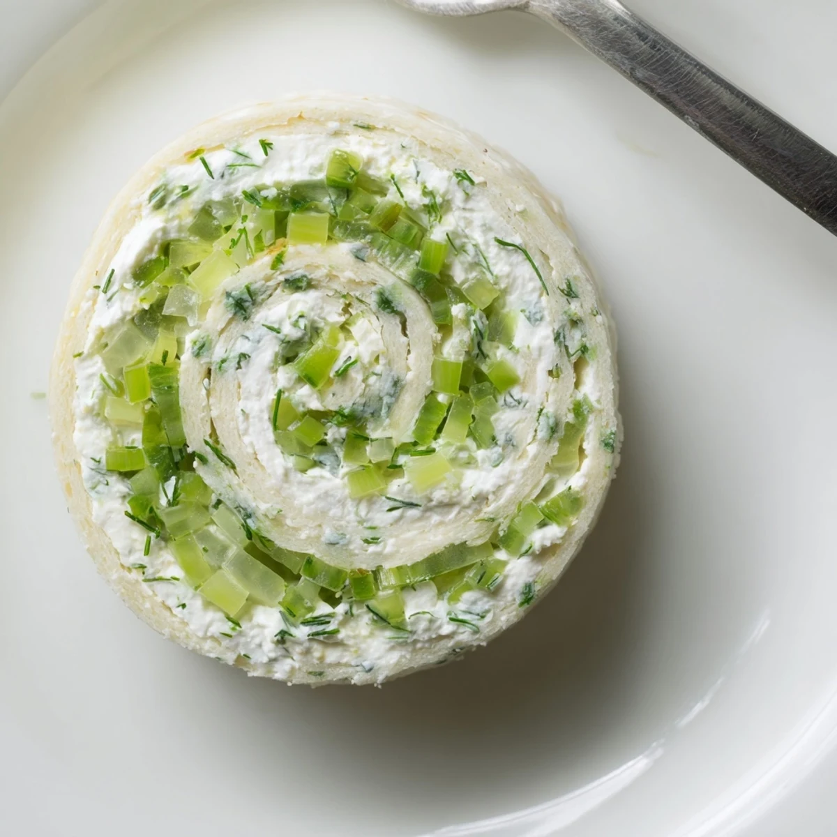 Pickle Dip Pinwheels arranged on platter, creamy centers and bright dill  
