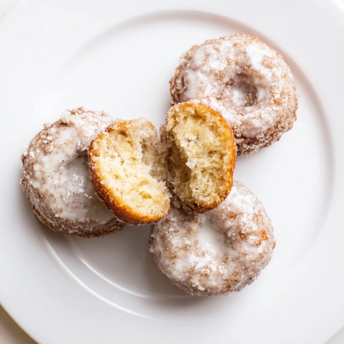 Fresh-baked Banana Donuts with cinnamon aroma, ready for breakfast plates.
