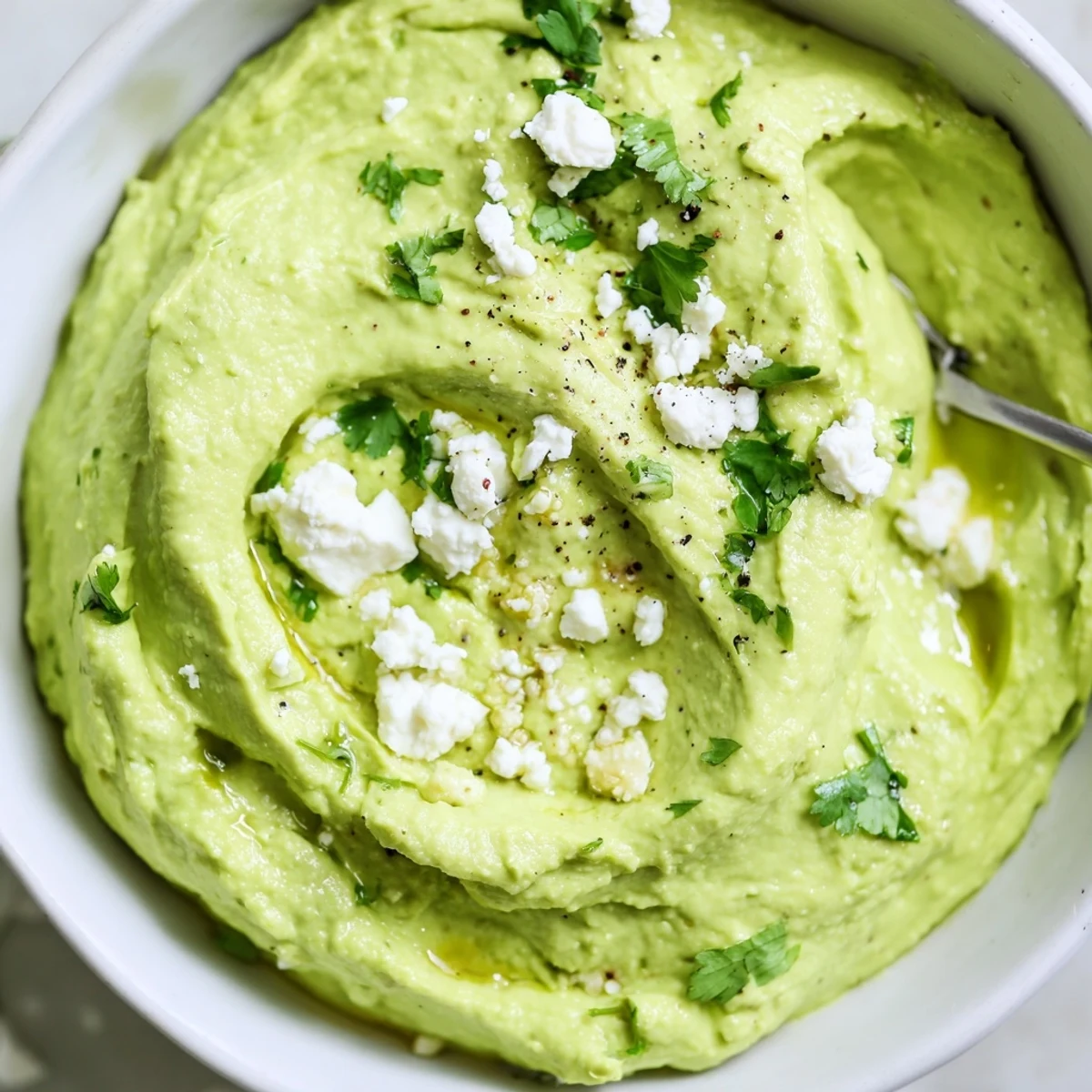 Bright green Creamy Avocado Feta Dip, tangy bite, ideal with toasted bread