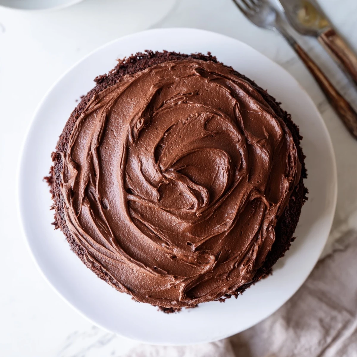 Decadent Matilda chocolate cake with velvety frosting and signature swooped swirls