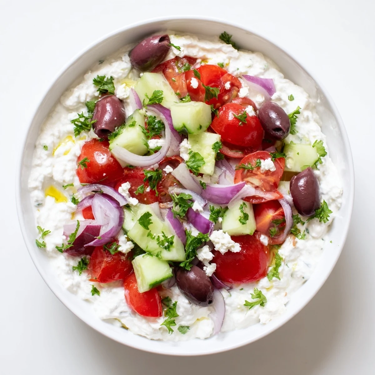 Protein-packed Greek salad cottage cheese bowl with colorful fresh vegetables and tangy feta