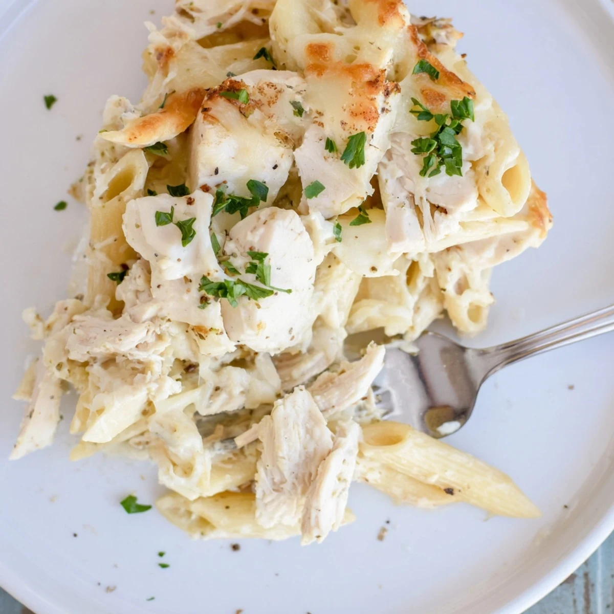 Creamy Chicken Alfredo Bake With Mozzarella Crust served with garlic bread and salad