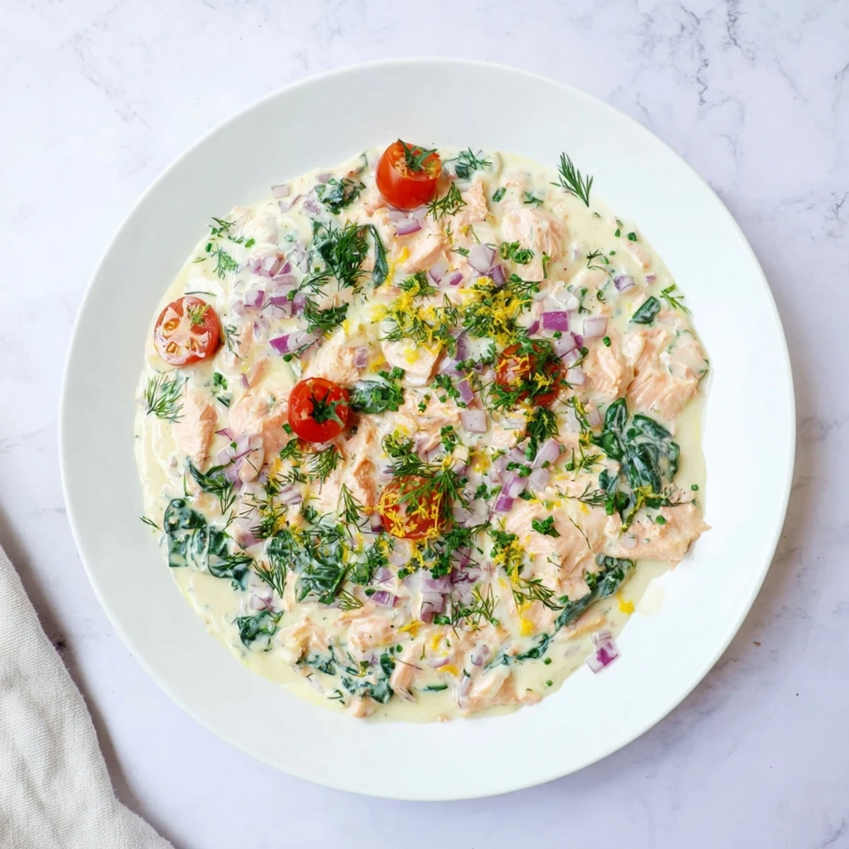 Bowl of healthy leftover salmon recipe served over brown rice with fresh parsley garnish.