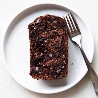 Sliced chocolate espresso banana bread revealing dark chocolate chunks and tender crumb texture