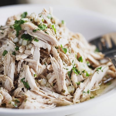Fork-tender Slow Cooker Cilantro Lime Chicken simmering with bright lime and cilantro aroma  